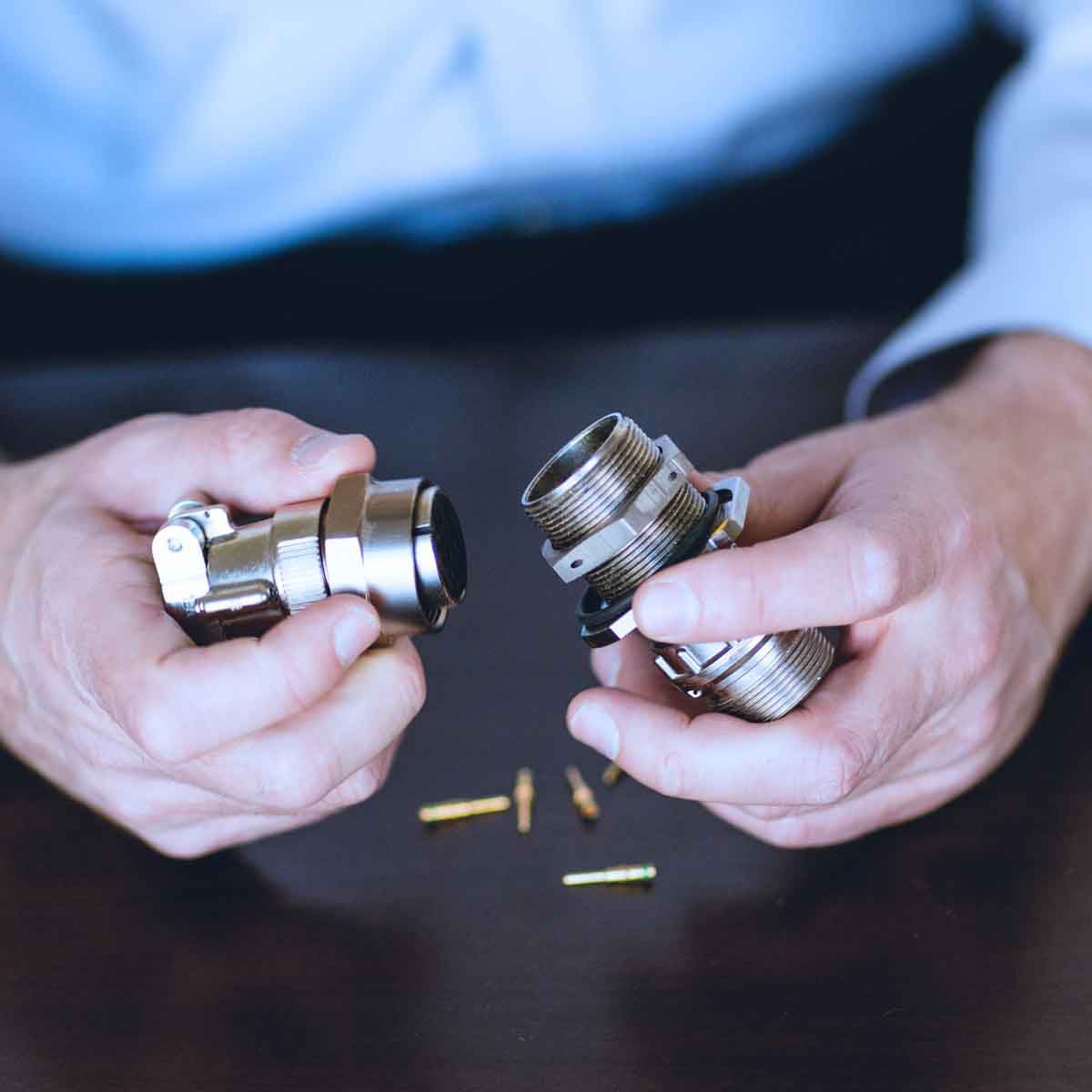 Engineer studying a metal connector